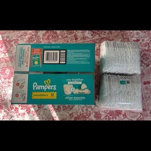 Brand new, unopened 126 count of newborn pamper swaddlers.